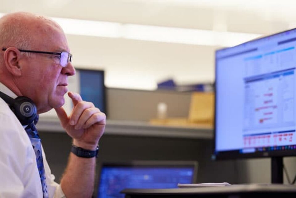 A Loeb Electric employee studying a lighting project's dashboard